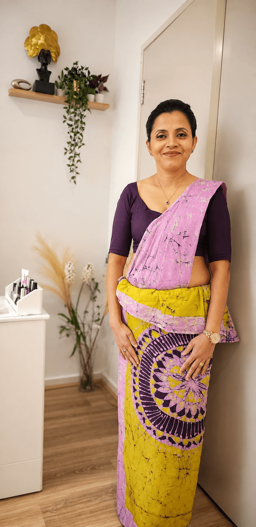 Special-occasion makeup and styling with a purple batik saree