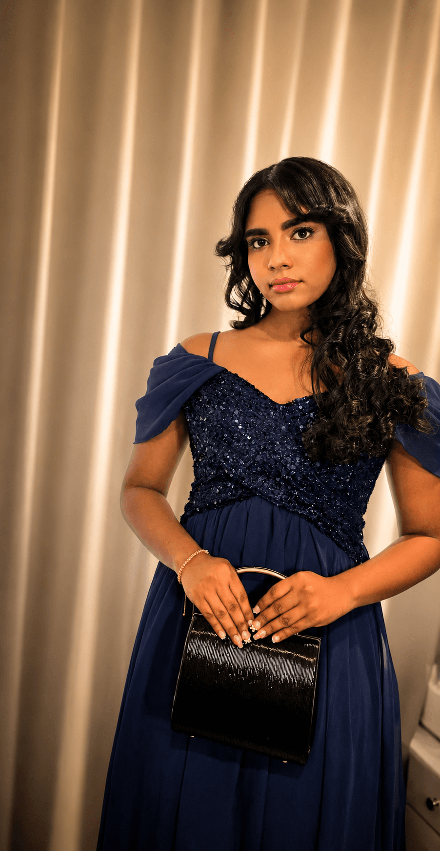 Formal event makeup and styling with a navy sequinned dress